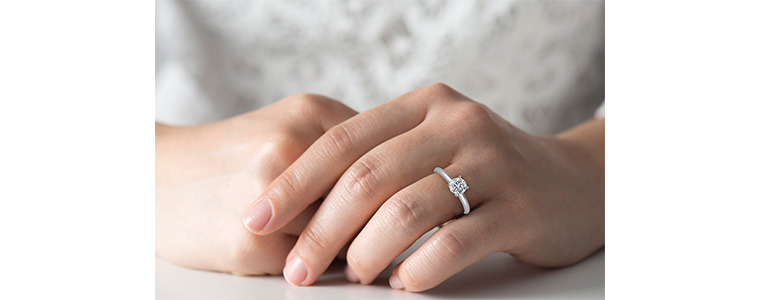 Hand modeling a 1 carat diamond ring.