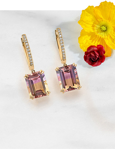 Gold gemstone earrings and pendant.